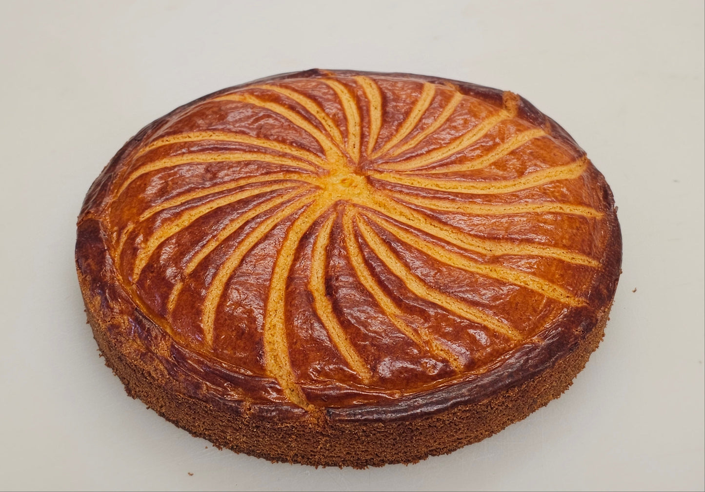 Round cake with a decorative pattern on a white background