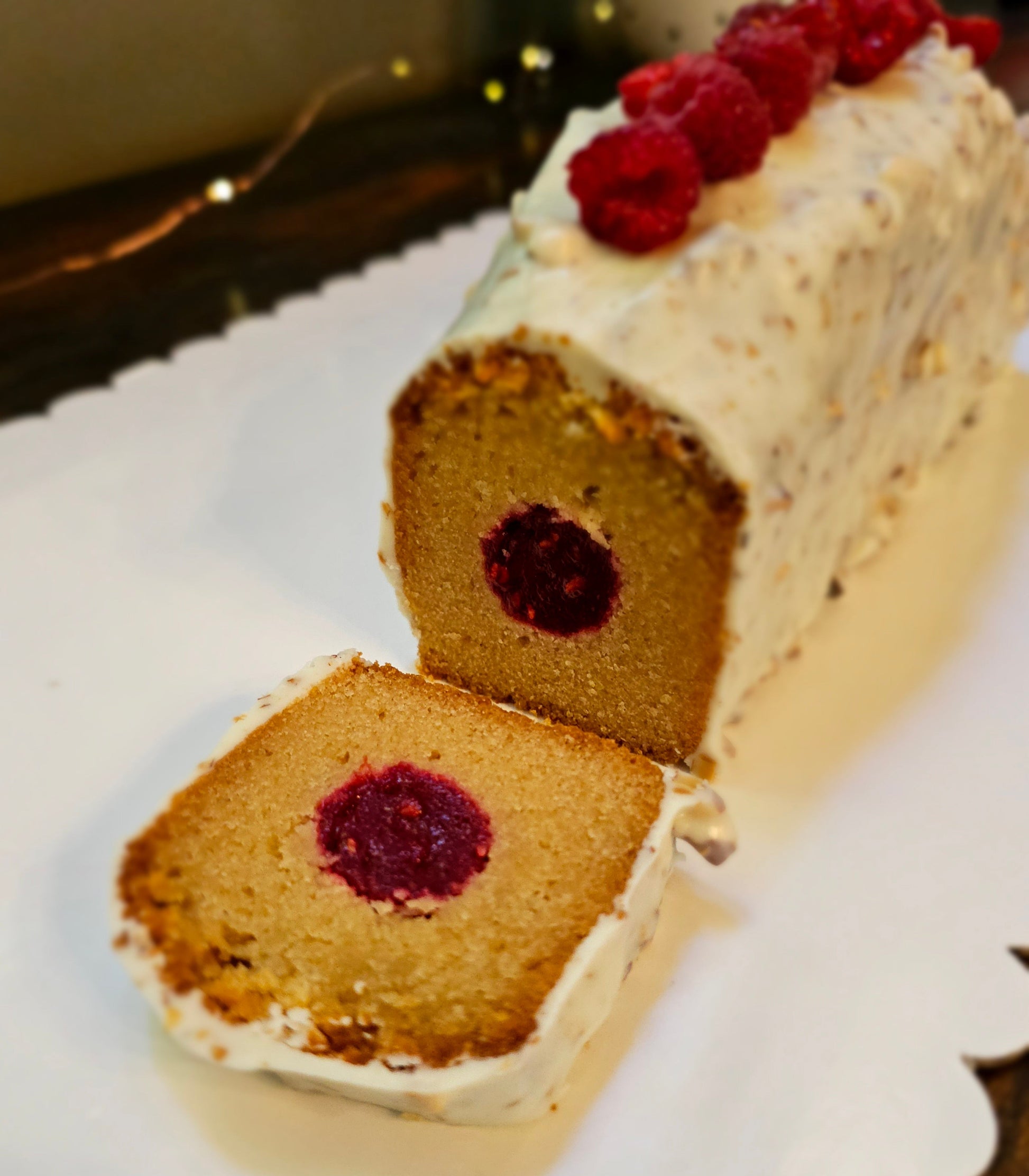Cake with raspberry filling on a white plate