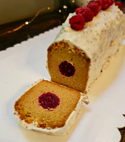Cake with raspberry filling on a white plate
