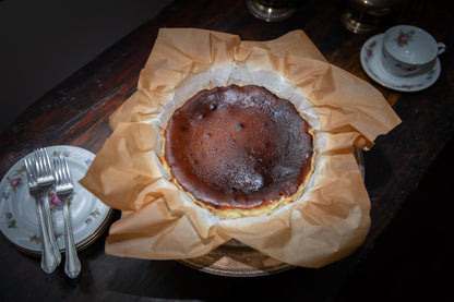 Top view of a basque cheesecake showing the dark caramelized top.