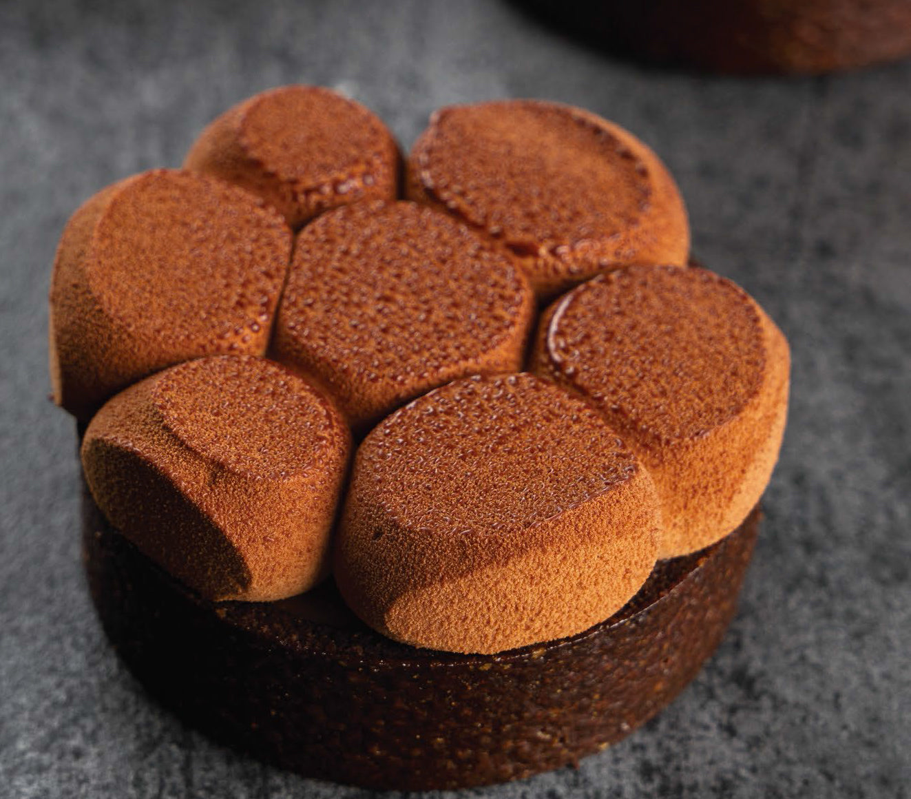 Close up of a chocolate and caramel tart.