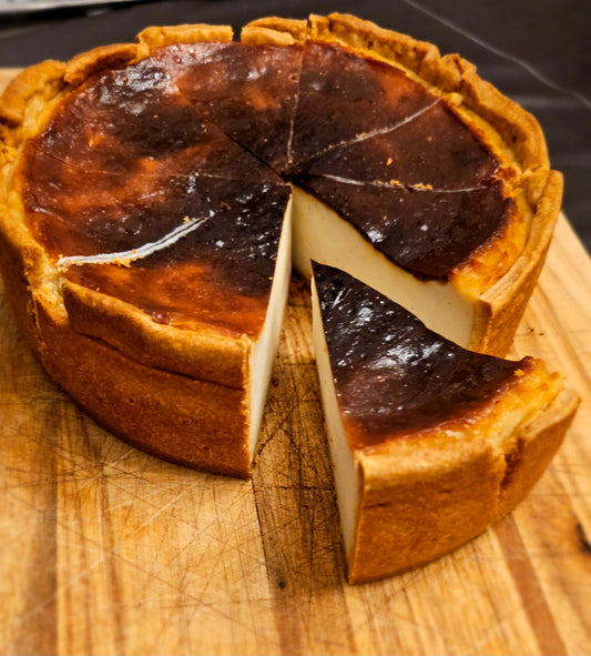 Parisian Flan sliced into wedges with one slice pulled out.