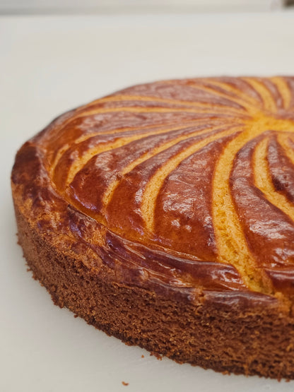 Close-up of a gateau basque showing the scored pattern on top
