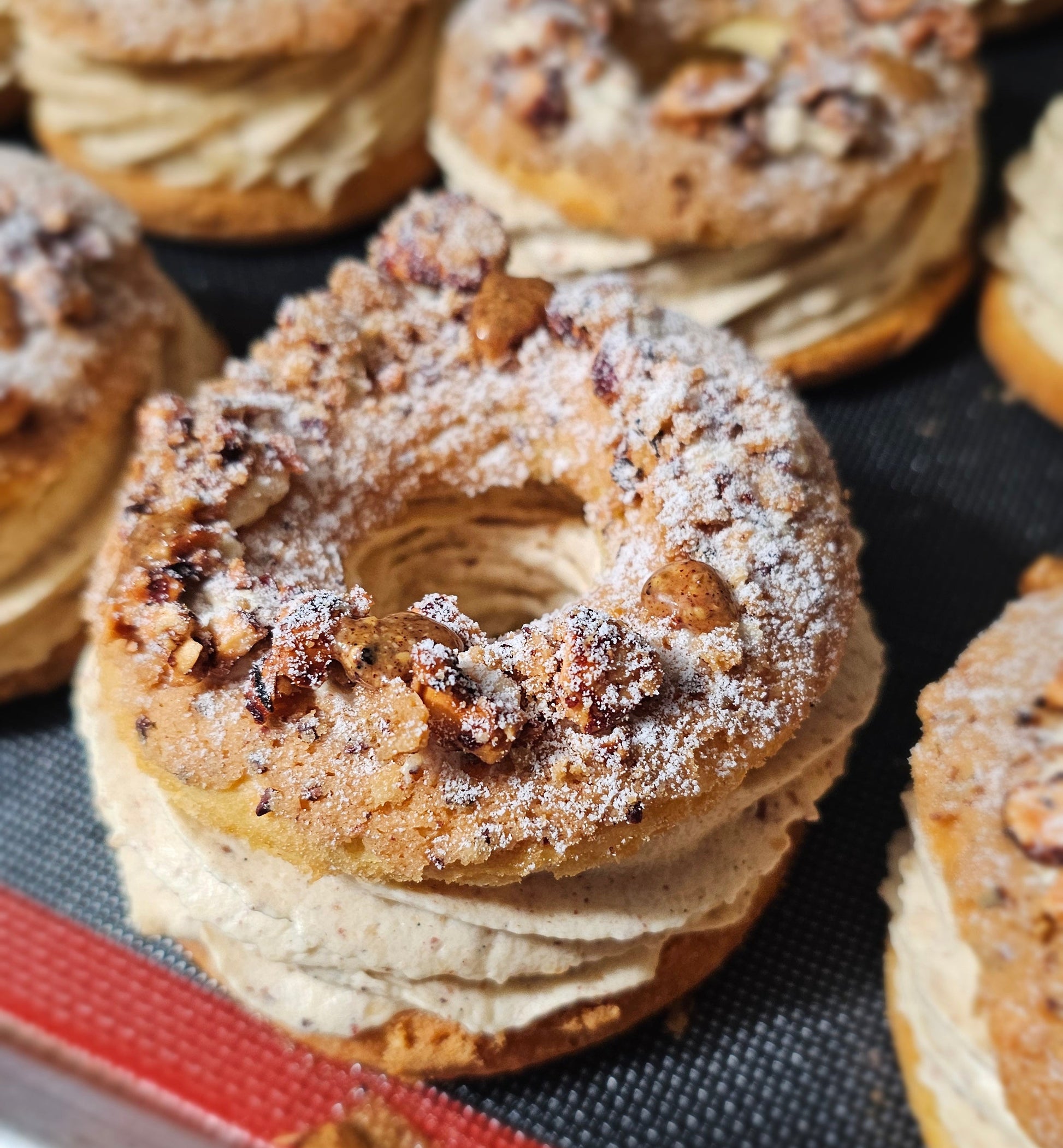 Paris Brest with chopped hazelnuts and snow sugar.