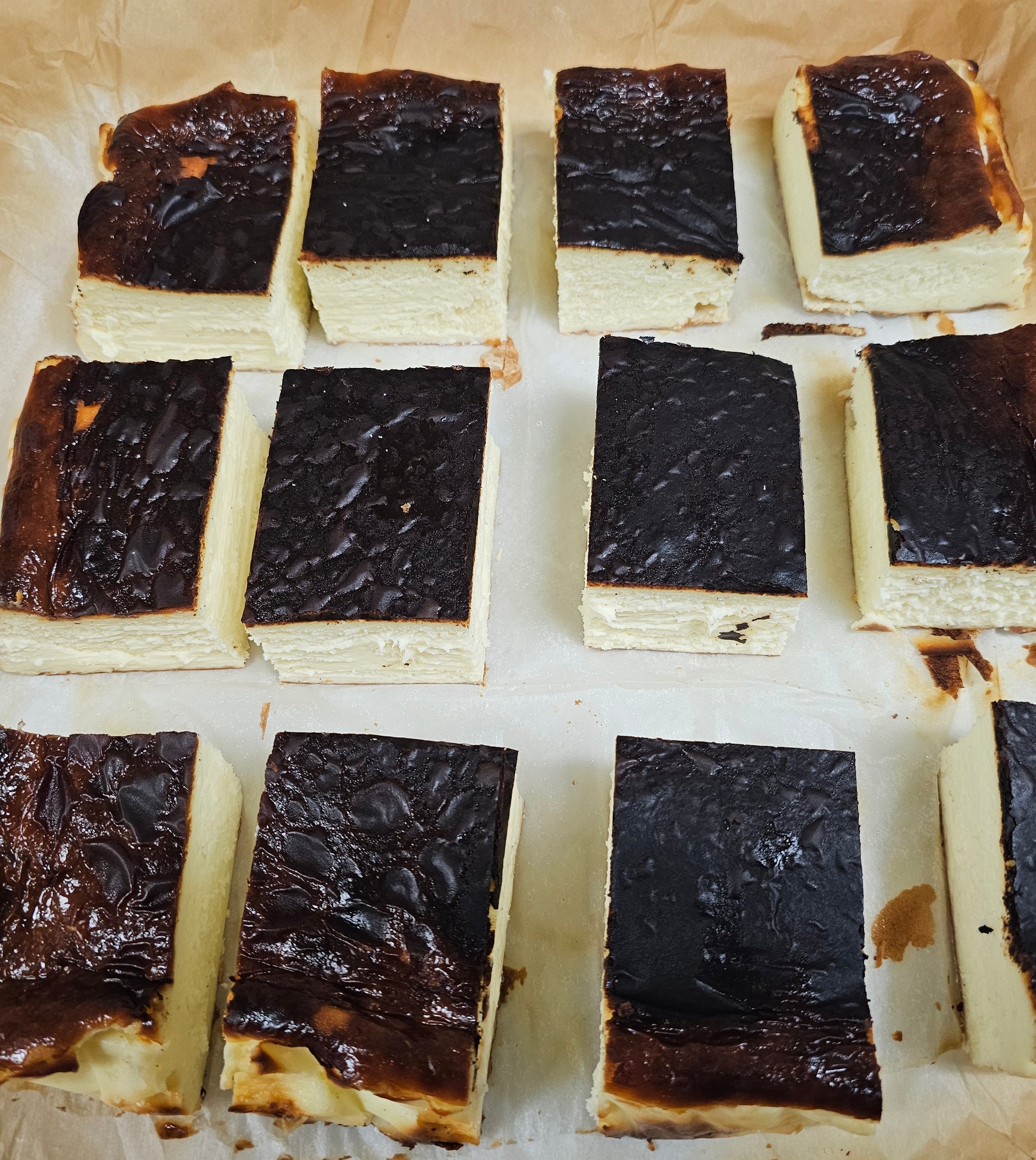Square slices of basque cheesecake.